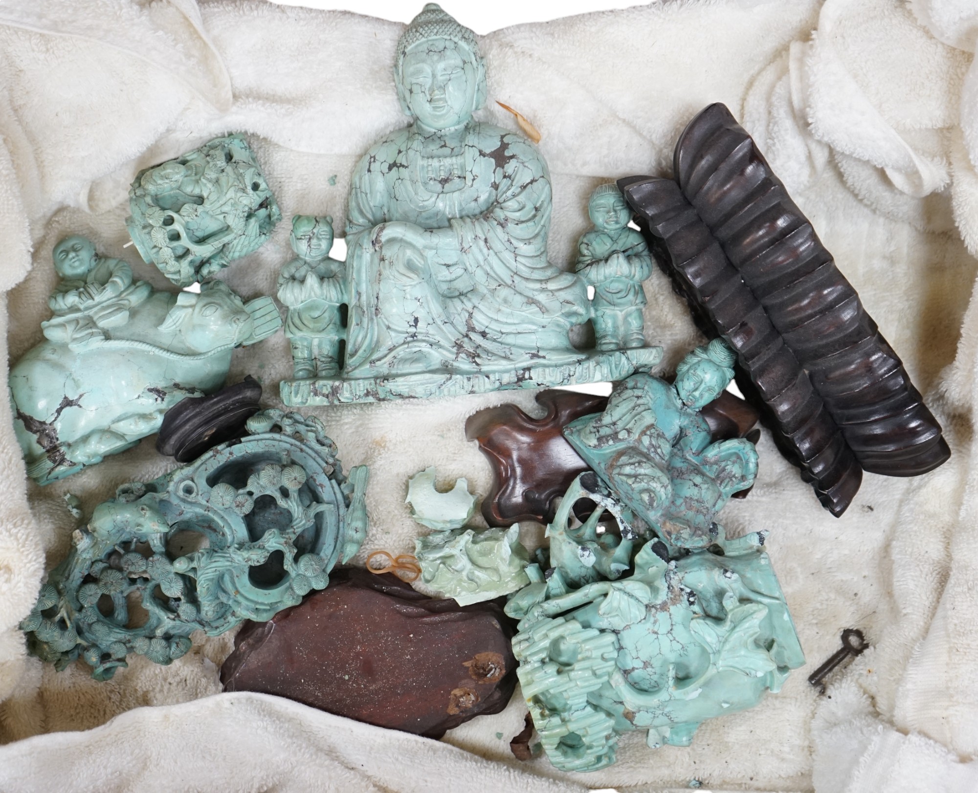 A group of Chinese turquoise matrix carvings, comprising a boy on a buffalo, 5.5in. a brushwasher, 7in. a vase and cover, 6.5in. a snuff bottle and a figure of a woman, 4.5in. (all a.f.)